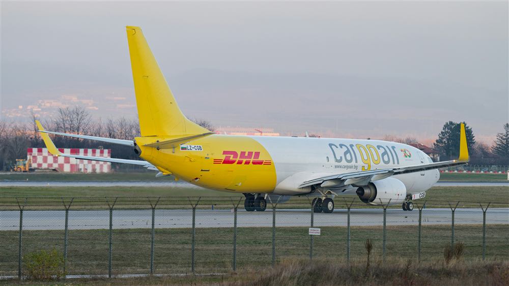 Cargo aircraft on an airport ramp, representing freight and logistics movement.